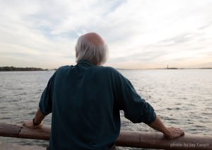 The author visioning his Manhattan story at the tip of the island he swam around.